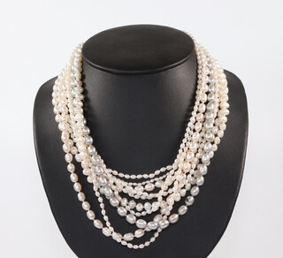 A multi strand necklace of cultured pearls with a yellow metal 14k clasp, 44cm 