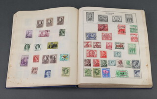 A blue stamp album of world stamps - GB, Austria, Belgium, Ceylon, Germany and India 