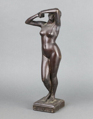 A cast iron figure of a standing Eve raised on a rectangular base, base marked Eve 39cm x 9cm x 9cm 