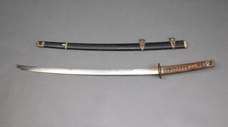 A Japanese 1937 Naval Officers sword (Kai-Gunto) forged by Fujiwara Kanefusa (1899-1977) with wooden saya finished in black lacquered leather, the 70cm blade with clear hamon, the complete length 99cm including saya.  The plain tsuba supported by two copper sunburst dai-seppas then 4 plain ovoid seppas (all are stamped 91). The length of the tang engraved "Kanefusa the 23rd, resident of Seki in Noshu" and three characters painted in white enamel on the obverse also a 5mm Seki mark at the base of the tang.  The brass fuchi on the handle can be removed to reveal an unclear signature on the wood.

The sword was gifted to Captain Clifford Caslon C.B.E by the Admiralty, due to his presence in command of the battleship H.M.S Nelson at Singapore during the surrender of Japanese forces in all of South-east Asia on 12th September 1945 in her role as Flagship, Eastern Fleet. 10 days earlier Caslon had hosted the surrender of Japanese forces in Malaya at George Town, Penang by Rear Admiral Jisaku Uozumi aboard the Nelson, following this, H.M.S Nelson was relieved as Flagship, Eastern Fleet on 20th September 1945 before returning to Portsmouth where on 27th November 1945 she became Flagship of the Home Fleet and together with a photographic portrait of Captain Caslon in uniform 30cm x 22cm, a warrant of commission promoting him to the rank of Rear Admiral dated 8th January 1947 framed 18cm x 36cm, a bar of miniature ribbon and other ribbons, 3 Admiral's buttons, a black and white photograph of H.M.S. Nelson with brass plaque H.M.S. Nelson Flagship Homefleet 1946 Captain Caslon CBE framed 41cm x 59cm and a brass plaque marked Clifford Caslon RN 8cm x 15cm 

Provenance - from Admiral Caslon by direct descent to his son Denis Caslon 