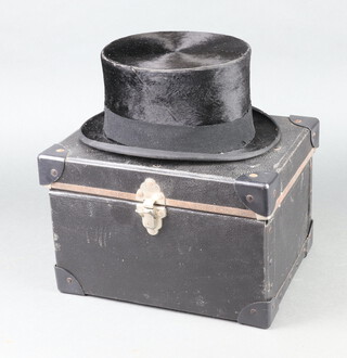 A Mrs White of Jermyn Street black dressage top hat, size 7 1/8 (some moth damage)