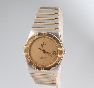 A gentleman's vintage steel cased bi-metallic Omega Constellation calendar wrist watch with quartz movement and original Omega clasp, no. 1392/012, together with original International guarantee dated 1987 