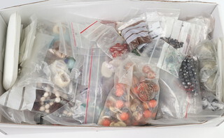 A quantity of mixed hardstone necklaces and other loose beads 