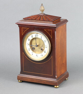 J Martin, a 19th Century French 8 day mantel clock striking on a gong, the 10cm enamelled dial with Arabic numerals, contained in a Georgian style inlaid mahogany case on bun feet 33cm h x 17cm w x 11cm d   