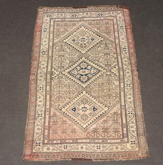A red and blue ground Persian rug with 3 diamonds to the centre within a multi row border 188cm x 120cm 