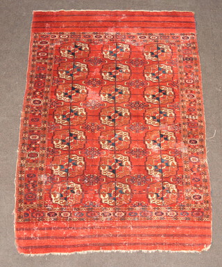 A red and blue Bokhara rug with 21 octagons to the centre 181cm x 120cm 