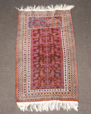 A tan, blue and orange ground Belouche rug 143cm x 88cm 