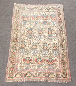A Caucasian style brown, tan and white ground rug with all over geometric design 188cm x 129cm 