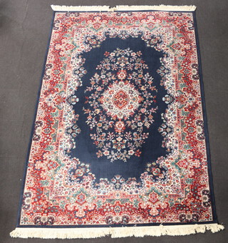 A blue, white and red ground machine made Persian style carpet with central medallion 336cm x 232cm 