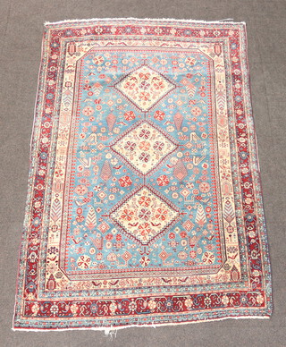 A blue and cream ground Caucasian style rug with 3 diamond medallions to the centre within a multi row border, bird decoration 182cm x 117cm 