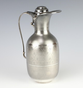 A mid-Century Sterling silver jug and cover with simple engraved decoration, 575 grams 