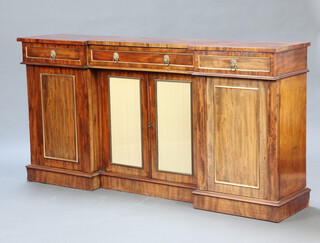 A Regency mahogany inverted breakfront sideboard fitted a drawer above double cupboard enclosed by glazed panelled doors flanked by 2 short drawers above pair of cupboards enclosed by panelled doors, raised on a platform base 93cm h x 183cm w x 40cm d 