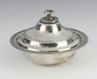 A Continental white metal bowl and cover with a floral finial 