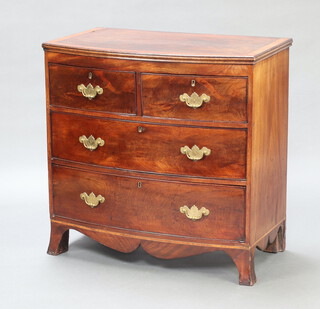 A Georgian crossbanded mahogany bow front chest of 2 short and 3 long drawers with replacement brass swan neck drop handles, raised on bracket feet 84cm h x 85cm w x 48cm d 
