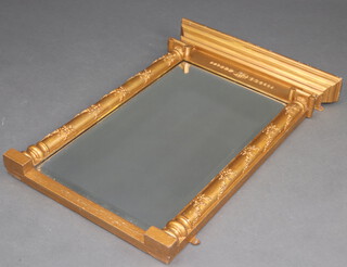 A Regency style rectangular bevelled plate pier mirror contained in a gilt painted frame with 2 ionic columns to the sides 75cm h x 53cm w x 8cm d 