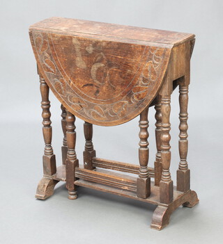 A Victorian carved oak oval drop flap gateleg tea table raised on turned supports 66cm h x 60cm w x 16cm 