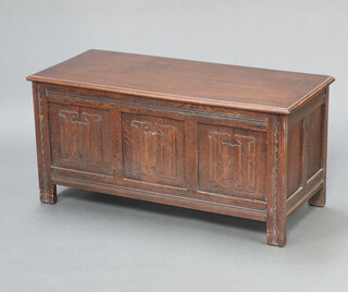 A 1930/40's carved oak coffer with linenfold decoration and hinged lid 50cm h x 105cm w x 45cm d