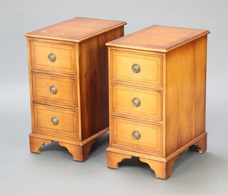 A pair of Georgian style crossbanded yew bedside chests of 3 drawers, raised on bracket feet 63cm h x 33cm w x 47cm d 