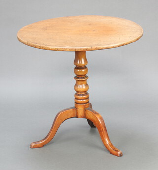 A 19th Century circular bleached mahogany snap top tea table raised on turned column and tripod base 69cm h x 73cm diam. 
