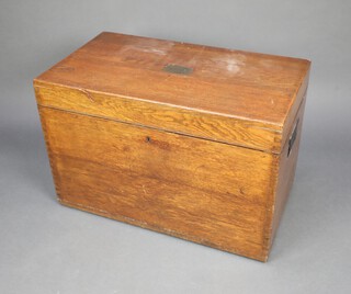 A 19th Century rectangular oak plate box with hinged lid and iron counter sunk handles 51cm h x 77cm w x 43cm d, complete with key 