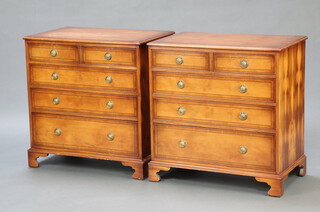 A pair of Georgian style yew chests of 2 short and 3 long drawers, with gilt ring drop handles, raised on bracket feet 75cm h x 77cm w x 48cm d 