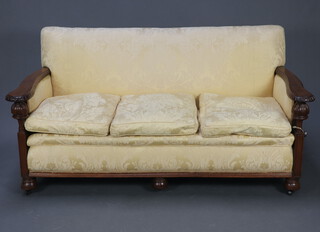 A 1930's oak show frame three piece settee suite comprising three seater settee and two matching armchairs upholstered in yellow material, the sofa - 86cm h x 176cm w x 88cm d, chairs - 86cm h x 80cm w x 88cm d