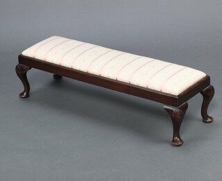 A Georgian style rectangular mahogany footstool raised on cabriole supports with drop in seat upholstered in Regency stripe, 25cm h x 93cm w x 30cm d 