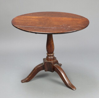 An 18th/19th Century oval oak occasional table raised on pillar and tripod base 58cm h x 69cm w x 57cm d 