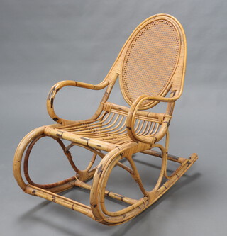 A Liberty style bamboo rocking chair with woven cane back 104cm x 57cm w x 57cm d 
