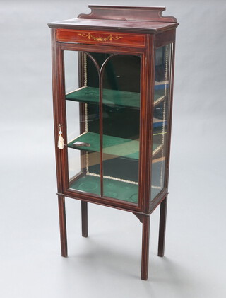 An Edwardian inlaid mahogany display cabinet with raised back, fitted shelves enclosed by astragal glazed panelled doors, raised on turned supports 139cm h x 57cm w x 27cm d 