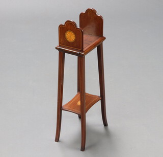 Edwards and Sons, 181 Regent Street, an Edwardian inlaid mahogany occasional table with upper section incorporating an expanding book rack, having a shaped undertier and outswept supports 63cm h x 21cm w x 14cm d 
