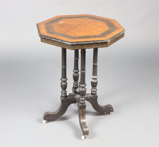 A Victorian figured walnut ebonised octagonal occasional table raised on 4 turned outswept supports 65cm h x 51cm w x 51cm d 