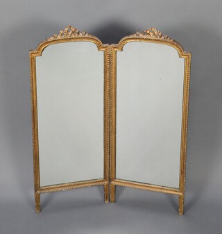 An Edwardian arched plate 2 fold mirrored fire screen contained in a gilt frame with ribbon garland 92cm h x 72cm w 