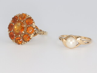 Two 9ct yellow gold rings, 1 set a cultured pearl the other hardstones, gross weight 9.4 grams, sizes O 1/2