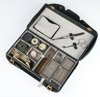 A Cartier pearl stringing set contained in a leatherette case with outer cover 