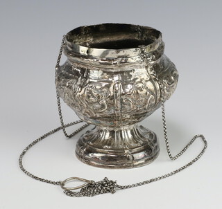 A Continental white metal repousse baluster bowl suspended by a white metal chain 
