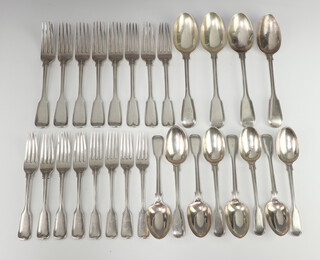 A matched canteen of George IV and Victorian fiddle pattern silver cutlery comprising 8 dessert forks, 8 dinner forks, 8 dessert spoons, 4 table spoons, mixed makers and dates 1827, 1853, 1859, 1865, 1877, 1896, all London, 1950 grams 