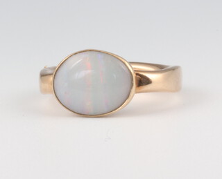 A 9ct yellow gold cabochon cut opal ring 5.4 grams, size L 