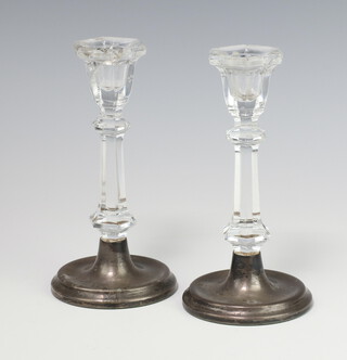 A pair of cut glass candlesticks with silver bases Birmingham 1990, 16cm 