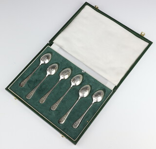 A set of Georgian style silver tea spoons with decorated backs - bird cage, dragon, cockerell, galleon, sheath of corn and fleur de lys, Sheffield 1982, 90 grams cased 