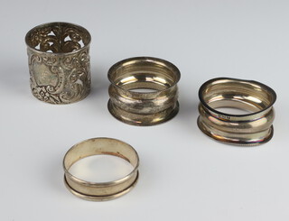 A Victorian repousse silver napkin ring Chester 1899 and 3 others 42 grams 