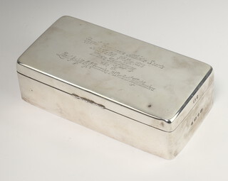 A Victorian rectangular silver cigarette box with engraved inscription Birmingham 1895, 19cm, together with a silver plated Ronson lighter   