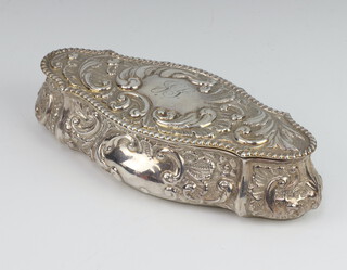 A Victorian silver serpentine trinket box decorated with scrolls and flowers and engraved monogram, Chester 1899, 16cm, 124 grams 