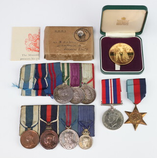 A group of commemorative medals to G Bullimore comprising 1897 Jubilee medal (bronze), Coronation medal 1902 (bronze), a 1911 Coronation medal (silver) and a Continental commemorative medallion named and dated 1919, together with 3 Continental commemorative medals and a group of Second World War medals comprising 1939-45 Star and War medal, silver gilt commemorative Wimbledon Centenary medallion and a framed photograph 