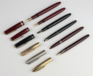 A Parker Maxima burgundy fountain pen with 14k nib, a Junior Duofold ditto with 14ct nib, a black Parker 51, a red Parker 61, a Schaeffer burgundy fountain pen with 14ct nib 