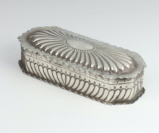 A Victorian rounded rectangular repousse silver trinket box with demi-fluted decoration London 1887, 14cm, 140 grams 