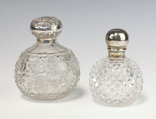 A Victorian silver mounted spherical cut glass scent bottle Birmingham 1902, a ditto London 1887 