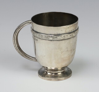 An Arts and Crafts silver waisted mug with inscription Birmingham 1937, 136 grams, 8cm 