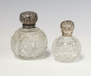 A Victorian silver mounted cut glass spherical scent bottle Sheffield 1896 10cm, a ditto London 1886 8.5cm 
