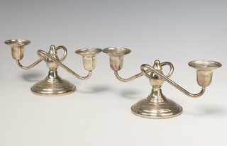 A pair of mid-Century filled Sterling silver 2 light candelabra 20cm, gross weight 564 grams 